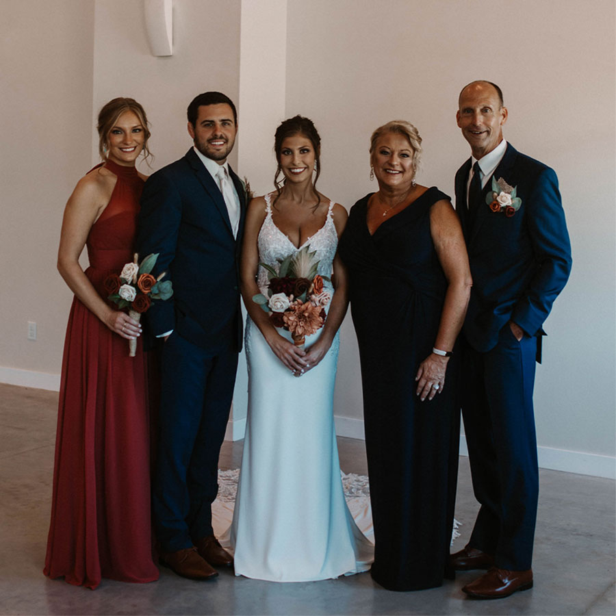 group of people standing together smiling