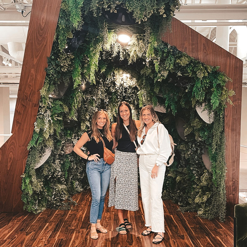 group of women standing together smiling